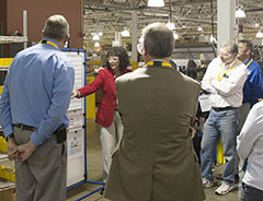 NGA Workforce Board members view production schedule board